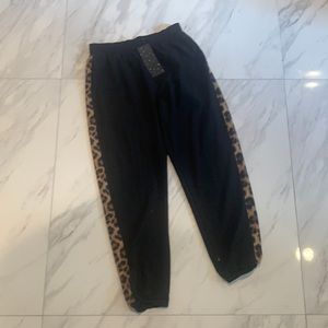 Terez woman’s thin pants size M black with leopard print stripe down the side